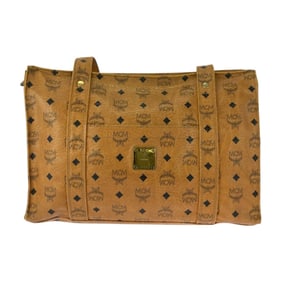 MCM Visetos camel leather tote bag with gold hardware.