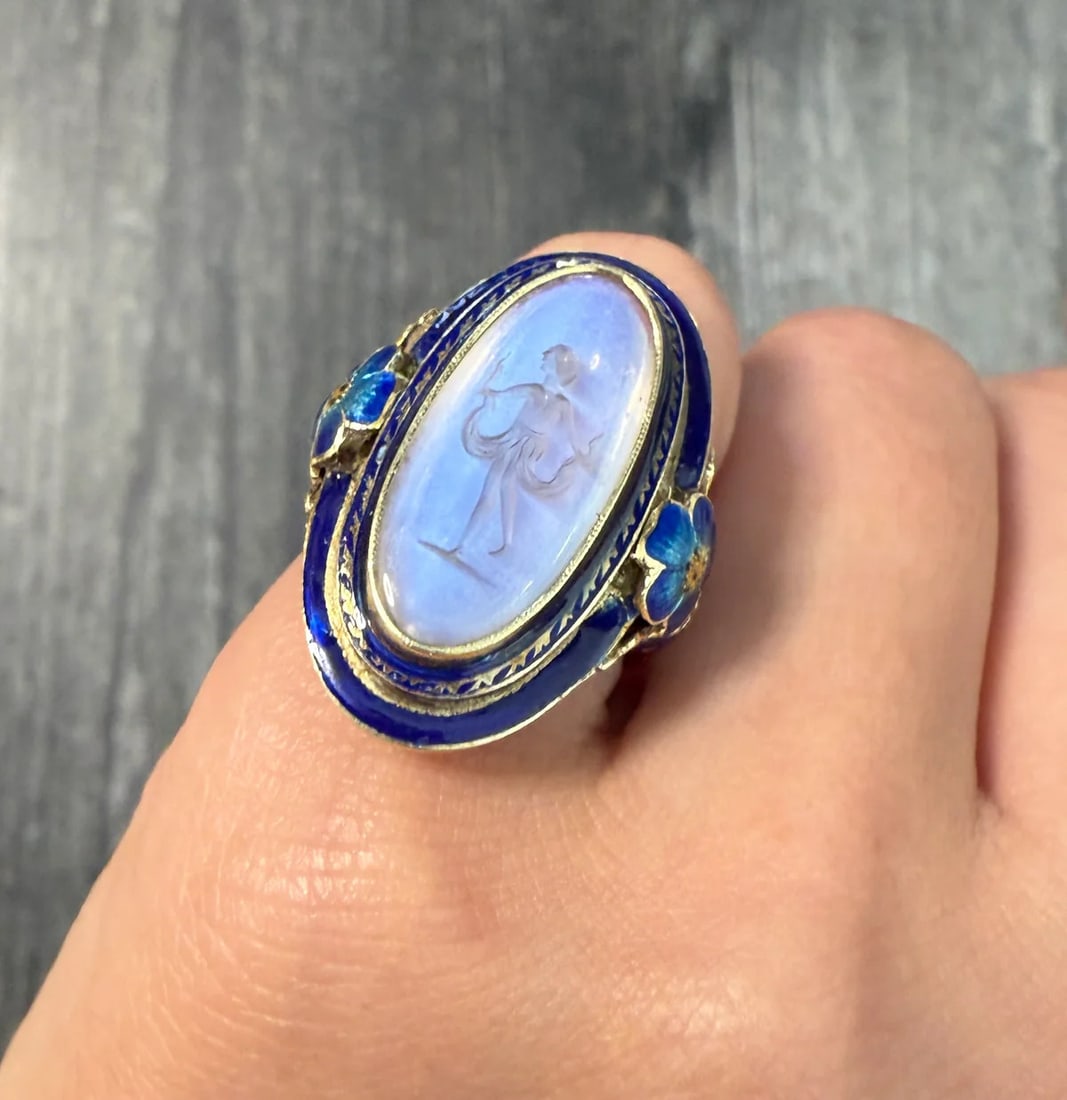 Antique Moonstone Intaglio and Enamel Flower Ring: Metal: 14K Yellow Gold Weight: 7.8 gramsRing Size: 5 (slightly resizable)Markings: "P.A.T PEND 14K"