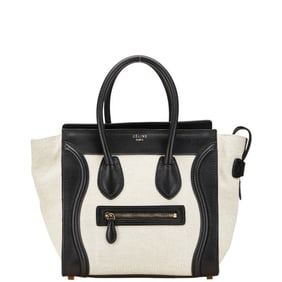 Celine Luggage Micro Shopper Handbag in Black and White Canvas Leather for Women.
