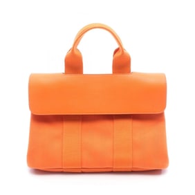 Hermes Hermès Valparaiso PM handbag in leather and canvas with Toile Chevron detailing, orange.