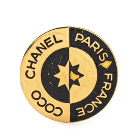 Chanel COCO logo round brooch in gold and black plated for women.