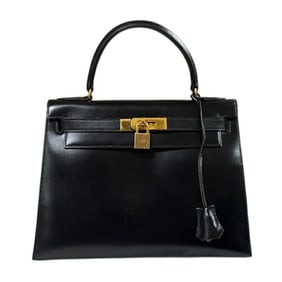 Hermès Kelly 28 handbag in black box calf leather with external stitching. HERMES