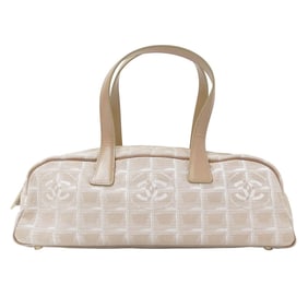 Chanel New Travel handbag for women, made of nylon in pink beige with gold hardware and a horizontal
