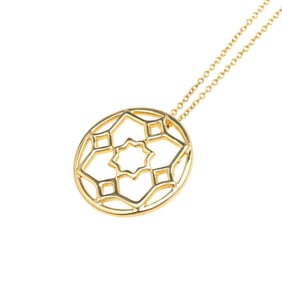 Tiffany & Co. Paloma Picasso Marrakech pendant necklace in 18k yellow gold for women. TIFFANY