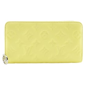 Louis Vuitton Coussin Zippy Wallet M83104, a long wallet in Smiley Yellow lambskin.