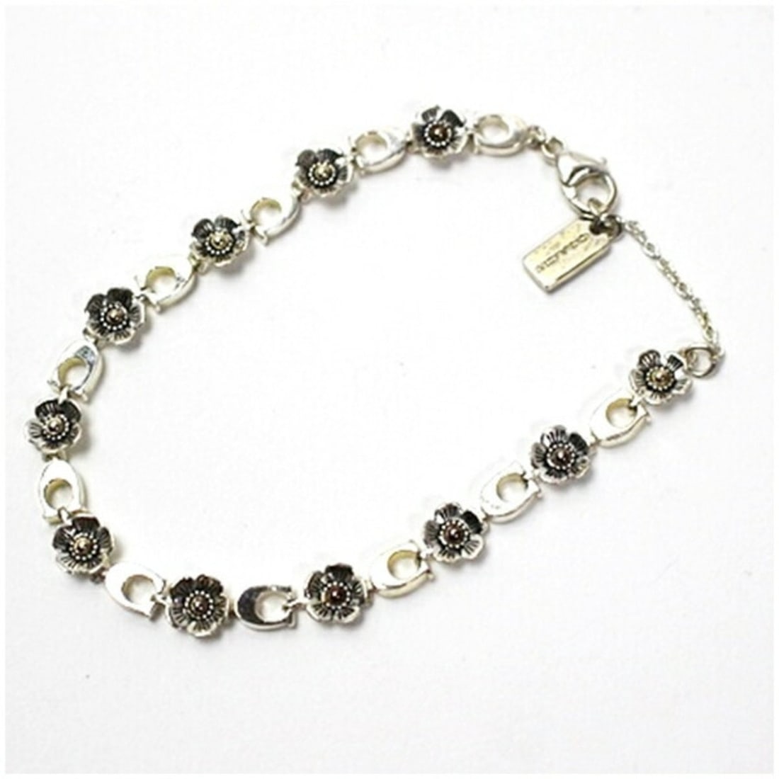 Coach Bracelet, Silver 925, Flower Motif, Women's: --- Catalog ---Category: SizeLength: 20cm / 7.87''Category: DesignType: Charm braceletColor: SilverGender: WomenMaterial: Silver 925Category: GeneralBrand: Coach--- Item List ---Section: ConditionRank