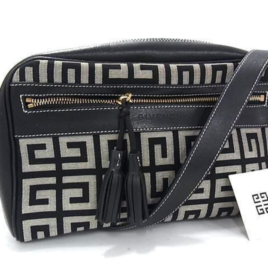 GIVENCHY Shoulder Bag in Black and Gray Canvas Leather with Patterned Tassel: --- Catalog ---Category: SizeSize (HxWxD): 13.5cm x 22cm x 6cm / 5.31'' x 8.66'' x 2.36''Category: DesignType: Handbag, Shoulder bag, Tote bagColor: Black, GrayGender: WomenMaterial: Canvas , Leather