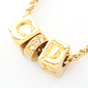 Christian Dior Dior CD logo necklace with gold-plated rhinestones, available in gold and clear.