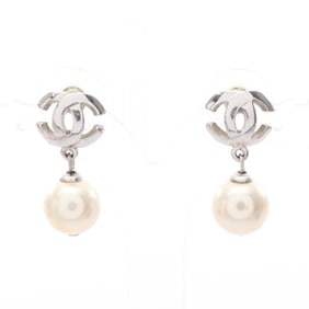 Chanel Coco Mark earrings in stainless steel with faux pearls for women silver and white.