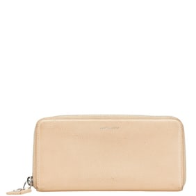 Saint Laurent round zipper long wallet in beige leather for women.