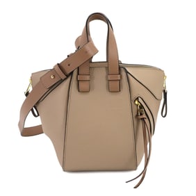 LOEWE Hammock Compact 2-way hand/shoulder bag in beige leather with gold hardware.