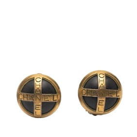 Vintage Chanel logo round earrings in gold and black plated plastic for women.