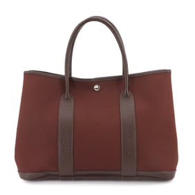 Gucci logo bracelet in black and gold plated leather for women.