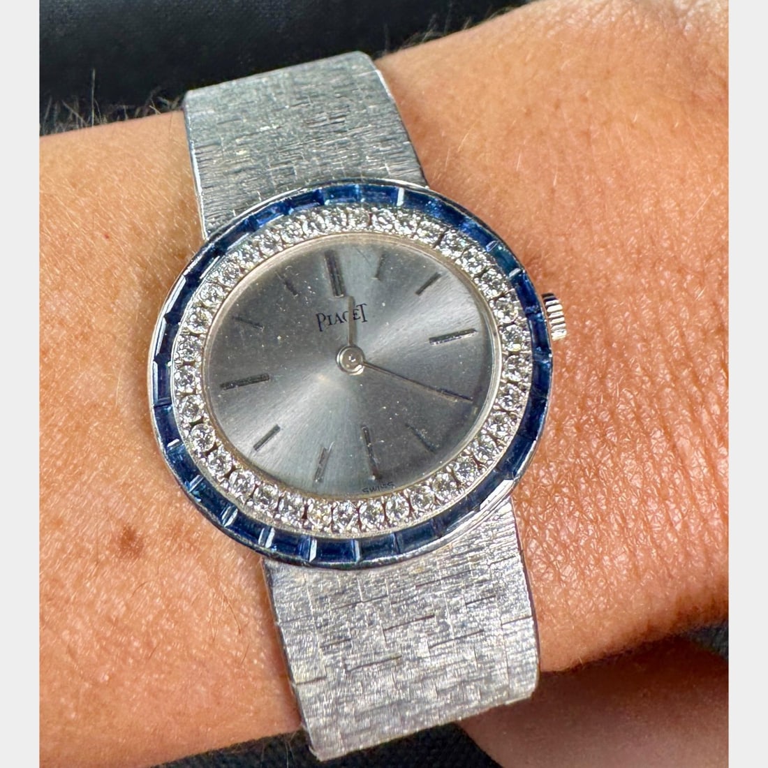 PIAGET 18K White Gold Diamond Watch: PIAGET 18K White Gold Diamond Watch?Weighing 70.8 gramsSet with 36 Diamonds on bezel weighing app. 1.00 Ct.?E-F Color, VVS-VS ClarityAlong with Synthetic SapphiresALL ORIGINALManual wind movement7.25