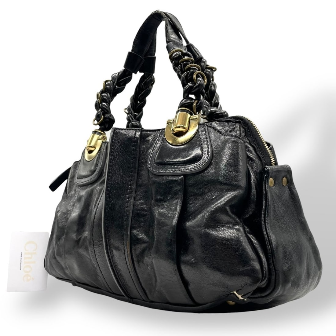 Chloé Eloise leather handbag in black with gold hardware and braided handles. 2000s.: --- Catalog ---Category: SizeSize (HxWxD): 21cm x 36cm x 14cm / 8.26'' x 14.17'' x 5.51''Category: DesignType: HandbagColor: BlackGender: WomenMaterial: Leather Category: GeneralBrand: Chloé--- Item