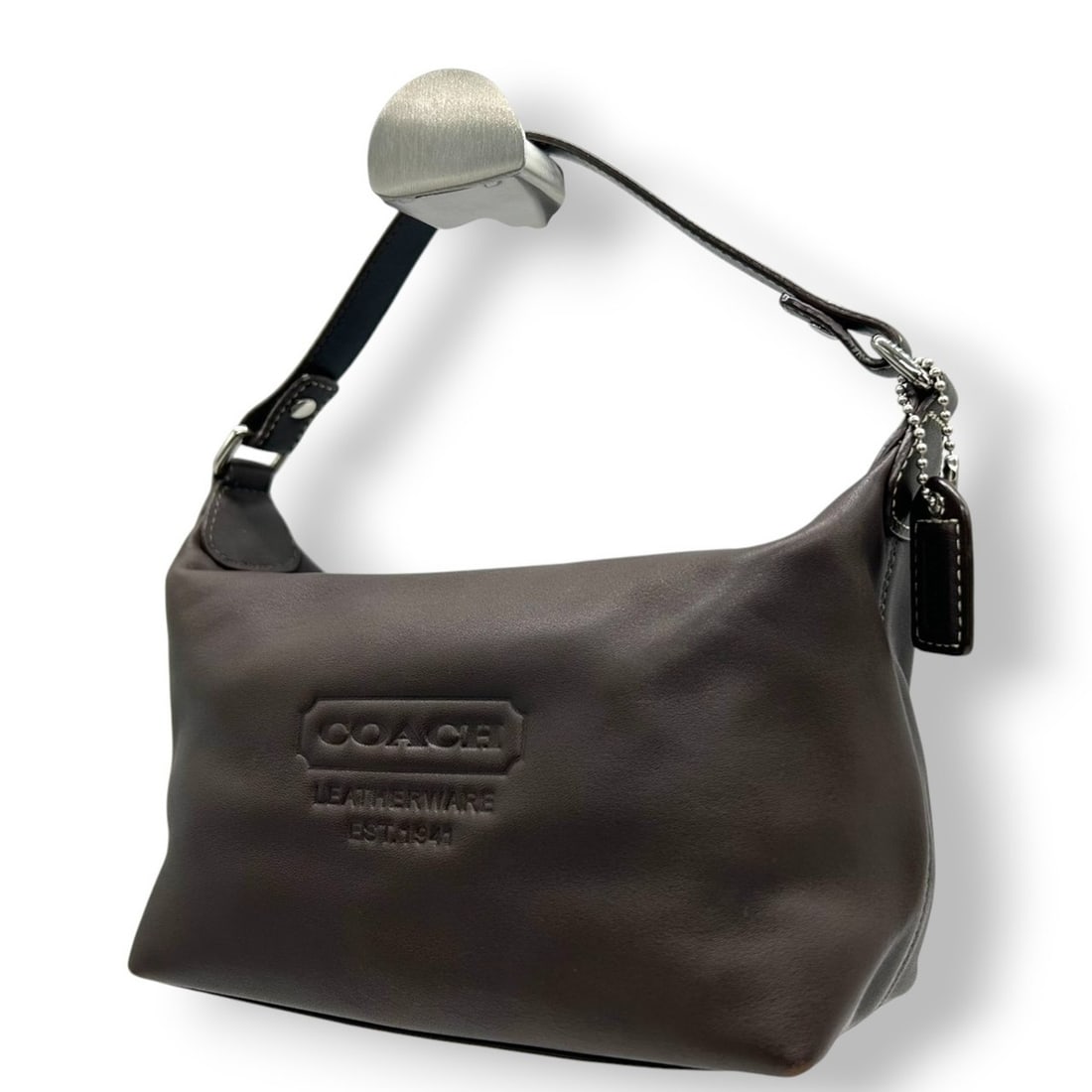 Coach Leather Handbag/Accessory Pouch/Mini Bag in Dark Brown with Embossed Logo and Stitching,: --- Catalog ---Category: SizeSize (HxWxD): 11cm x 21cm x 9cm / 4.33'' x 8.26'' x 3.54''Category: DesignType: Handbag, PouchColor: Brown, Dark brownGender: WomenMaterial: Leather Category: GeneralBrand