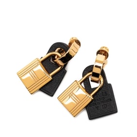 Hermes Hermès O'Kelly hoop earrings in gold and black plated Swift for women.