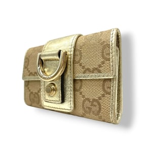 Gucci 5-ring key case in GG canvas and leather with Abbey D-rings, available beige, brown, gold.