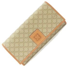 Celine bifold long wallet in beige macadam PVC leather. This is a women's wallet.
