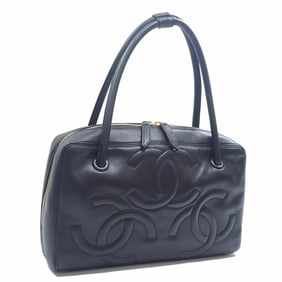 Chanel women's handbag in black leather with triple Coco mark