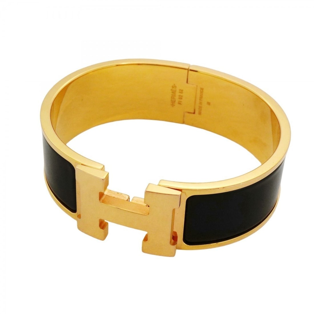 Hermes Click-Clack GM Bangle in GP-plated Gold and Black for Women: --- Catalog ---Category: SizeLength: 17cm / 6.69''Category: DesignType: BangleColor: Black, GoldGender: WomenMaterial: Gold platingCategory: GeneralBrand: Hermes--- Item List ---Section: ConditionRank