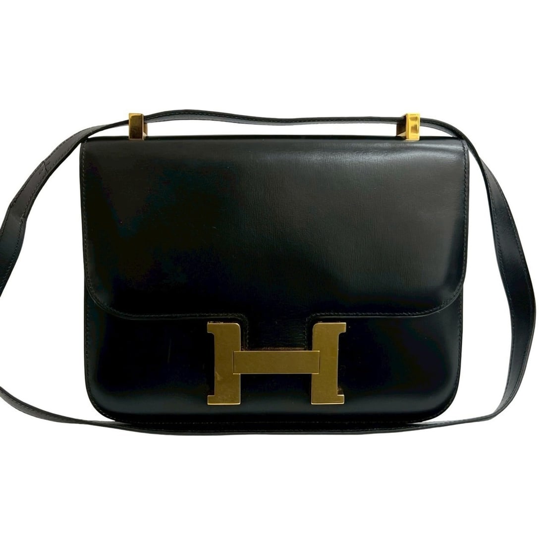 Hermes Hermès Constance 23 Logo Box Calf Leather Mini Shoulder Bag in Black (47805): --- Catalog ---Category: SizeSize (HxWxD): 18cm x 23cm x 3.5cm / 7.08'' x 9.05'' x 1.37''Category: DesignType: Shoulder bagColor: BlackGender: WomenMaterial: Box calf leather Category: GeneralBrand: H