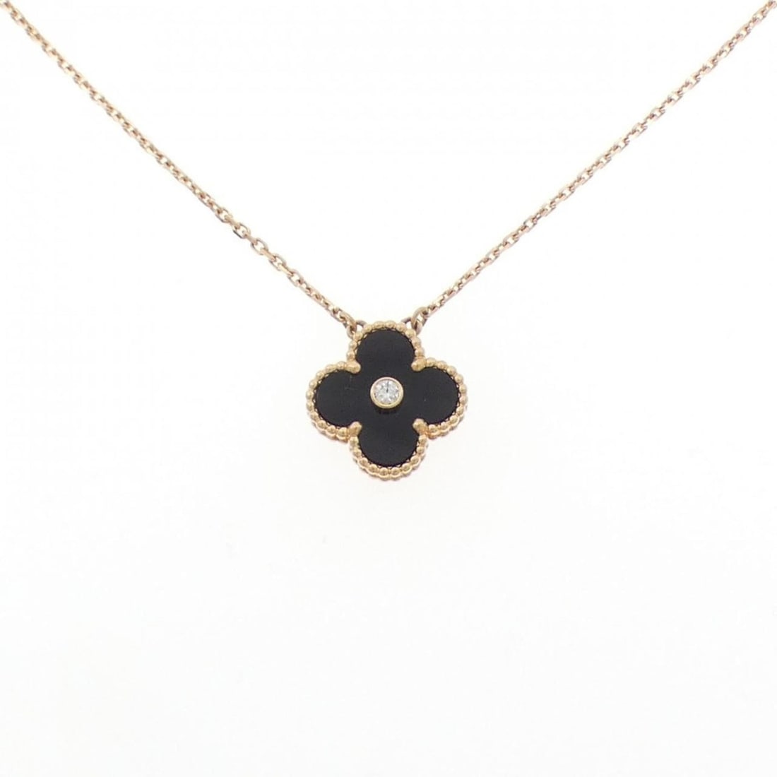 Van Cleef & Arpels Vintage Alhambra Necklace: --- Catalog ---Category: SizePendant Size: 14.7mm x 14.7mm / 0.57'' x 0.57''Neck Circumference: 37 cm - 42 cm / 14.56'' - 16.53''Category: DesignStone: Diamond, OnyxGender: WomenMaterial: Pink gold (1