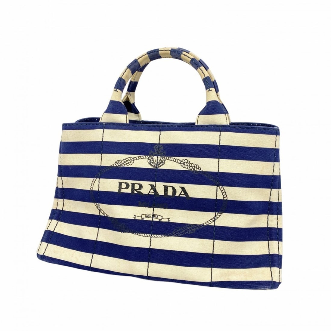 Prada Canapa Canvas Tote Bag in Navy and Ivory for Women: --- Catalog ---Category: SizeSize (HxWxD): 23cm x 34cm x 22cm / 9.05'' x 13.38'' x 8.66''Category: DesignType: Tote bagColor: Ivory, NavyGender: WomenMaterial: Canvas Hardware Color: GoldCategory: Gen