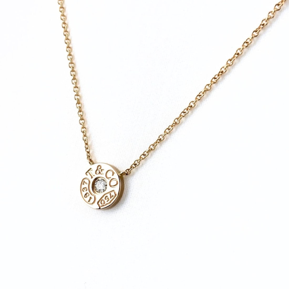 Tiffany & Co. 1837 Circle Necklace in PG Pink Gold with 750 Diamonds for Women: --- Catalog ---Category: SizePendant Size: 8.1mm x 8.1mm / 0.31'' x 0.31''Neck Circumference: 40 cm / 15.74''Category: DesignColor: PinkGender: WomenMaterial: Pink gold (18K)Pendant Type: PendantNeckl