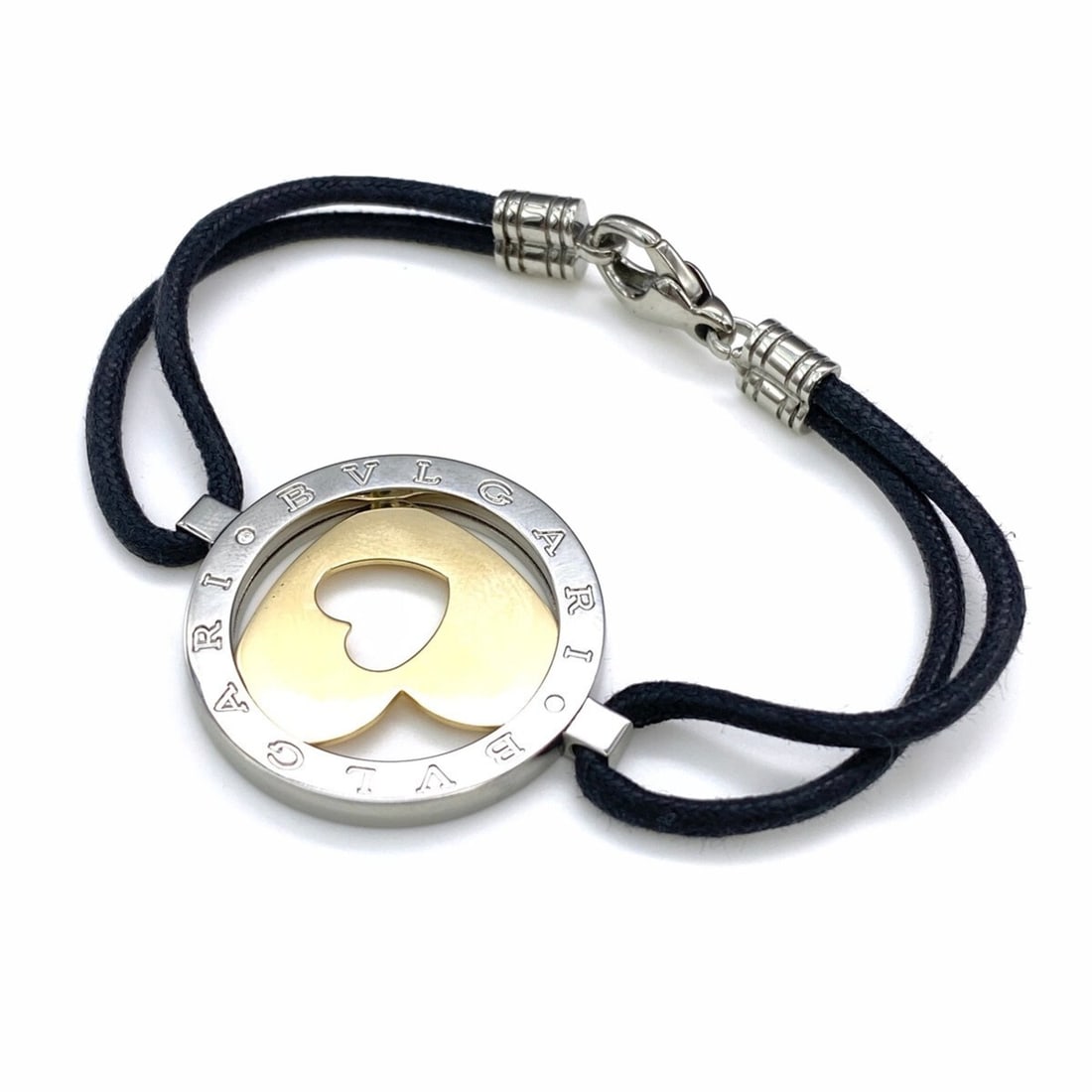 BVLGARI Tondo Heart Bracelet in Yellow Gold and Stainless Steel, 750 for Women: --- Catalog ---Category: SizeLength: 14cm / 5.51''Category: DesignType: Charm braceletGender: WomenMaterial: Stainless steel, Yellow gold (18K)Category: GeneralBrand: Bvlgari--- Item List ---Section: