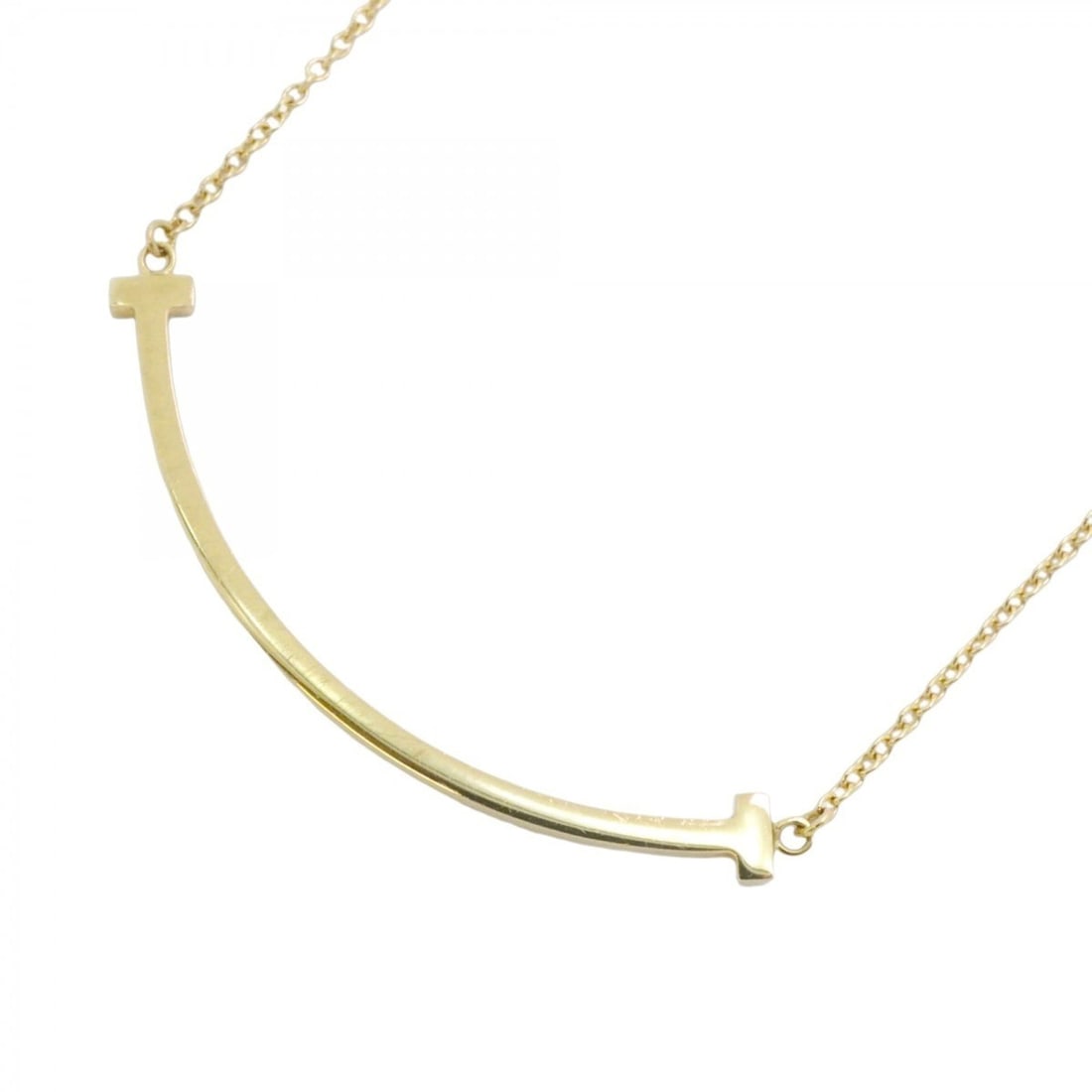 Tiffany T Smile Small Necklace in 18KYG Yellow Gold for Women: --- Catalog ---Category: SizePendant Size: 10mm x 37.7mm / 0.39'' x 1.48''Neck Circumference: 42 cm - 46.5 cm / 16.53'' - 18.3''Category: DesignGender: WomenMaterial: Yellow gold (18K)Necklace Type: N