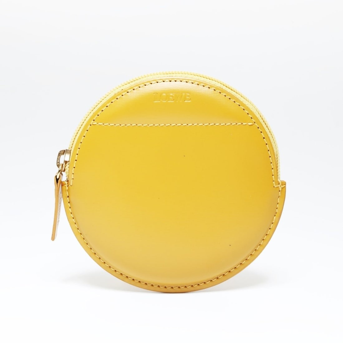 LOEWE Leather Round Wallet/Coin Case, Yellow: --- Catalog ---Category: SizeSize (HxWxD): 9cm x 9cm / 3.54'' x 3.54''Category: DesignType: Coin purse/coin caseColor: YellowGender: WomenMaterial: Leather Category: GeneralBrand: LoeweCountry of Orig