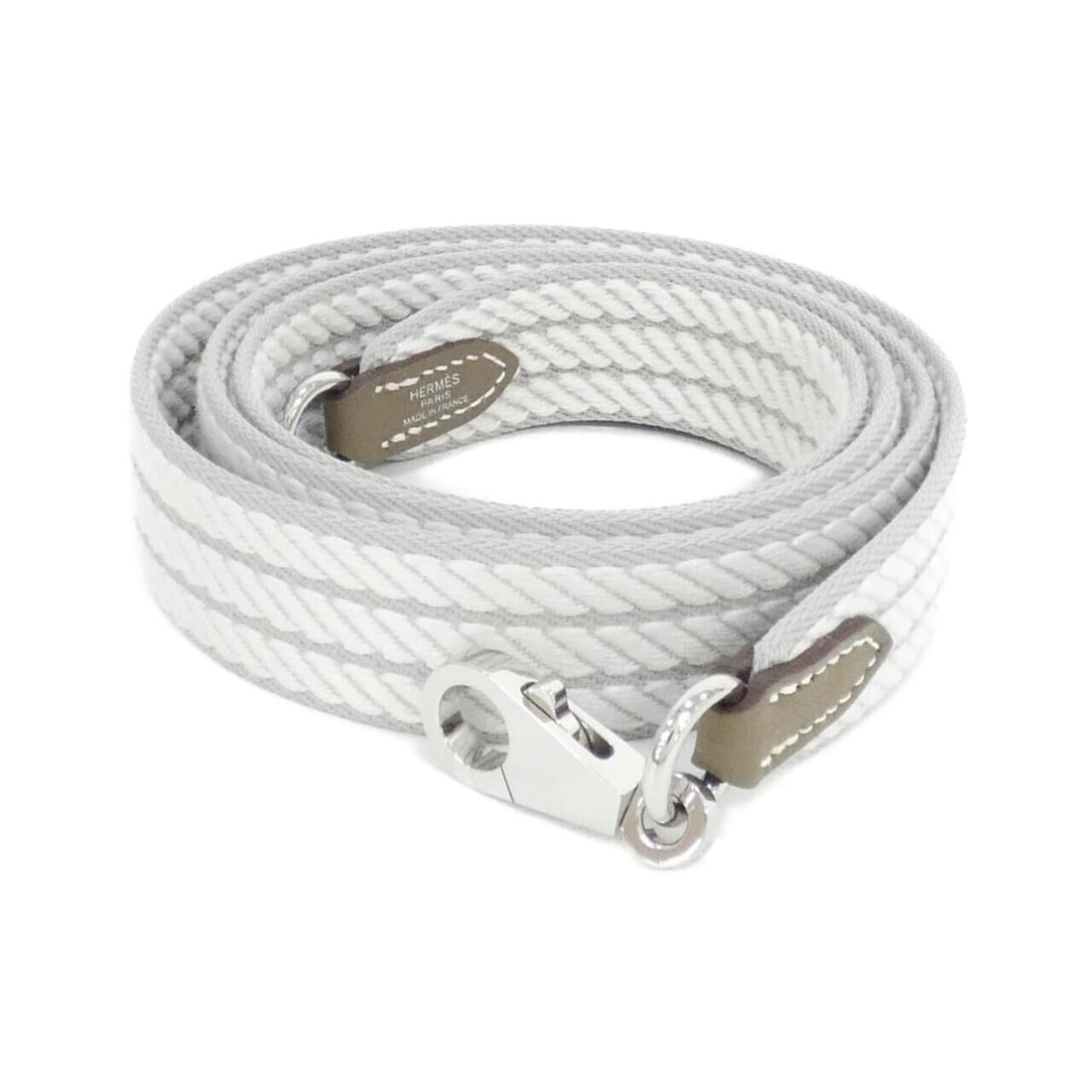 Hermes Sangle Cortage 085711CK Strap: --- Catalog ---Category: SizeSize (HxWxD): 112cm x 2.5cm / 44.09'' x 0.98''Category: DesignType: StrapColor: Etoupe gray, Silver, WhiteGender: Men,WomenMaterial: Canvas, Swift leatherCategory: General