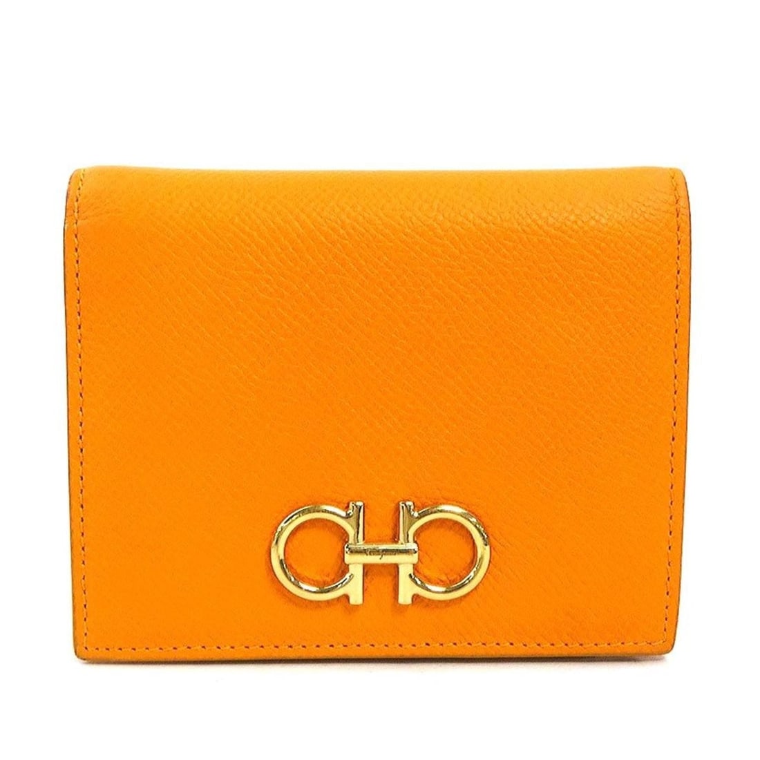 Salvatore Ferragamo Gancini Leather Bi-fold Wallet in Orange, Women's, h31838b: --- Catalog ---Category: SizeSize (HxWxD): 9cm x 11.3cm x 2cm / 3.54'' x 4.44'' x 0.78''Category: DesignType: Wallet (bi-fold)Color: OrangeGender: WomenMaterial: Leather Category: GeneralBrand: Salvat