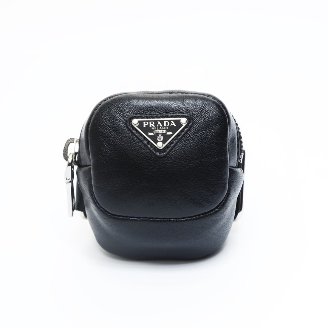 Prada Mini Leather Triangle Logo Charm Pouch in Black: --- Catalog ---Category: SizeSize (HxWxD): 8cm x 6.5cm x 3.5cm / 3.14'' x 2.55'' x 1.37''Category: DesignType: PouchColor: BlackGender: WomenMaterial: Leather Category: GeneralBrand: Prada--- Item Lis