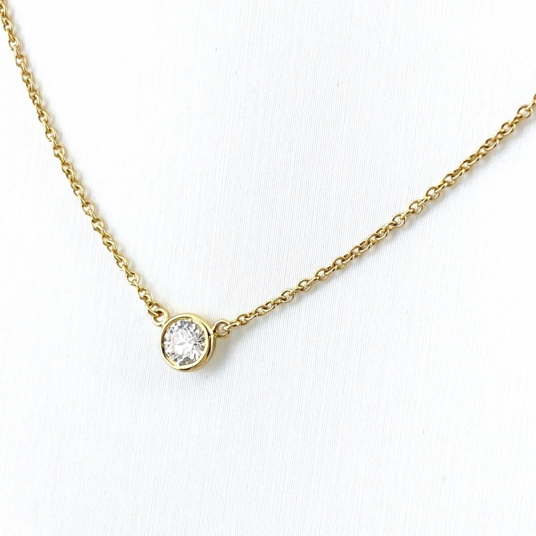 Tiffany & Co. By the Yard Necklace, Yellow Gold Pendant, Elsa Peretti 750 Diamond Women's: --- Catalog ---Category: SizeWeight: 1.9g / 0.06oz.Diameter: 4.8mm / 0.18''Neck Circumference: 41 cm / 16.14''Category: DesignColor: YellowMetal: GoldStone: DiamondGender: WomenMetal Purity: 18KPendan