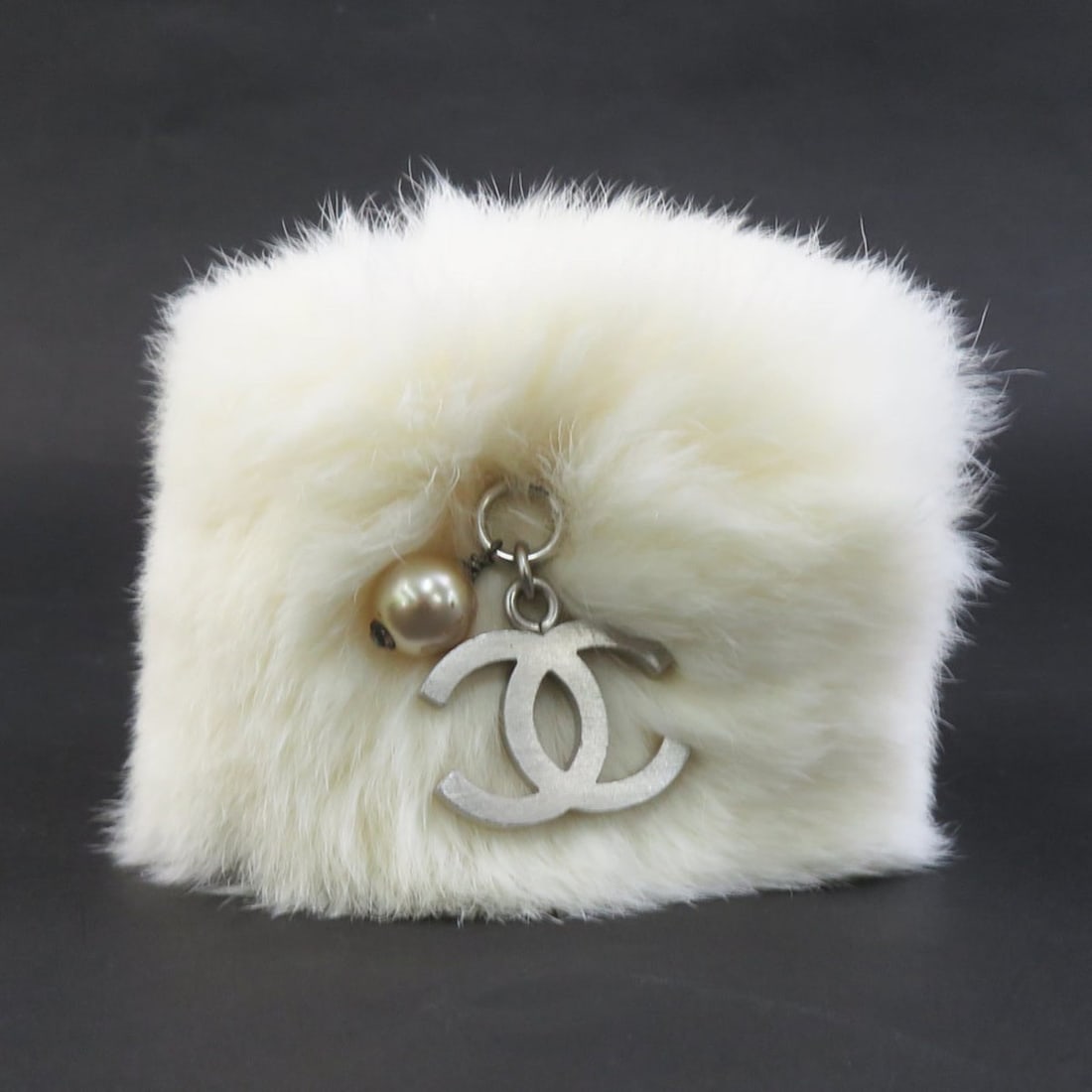 CHANEL Coco Mark Rabbit Fur Bracelet Wristband in Off-White and Silver, Women's, e61302g: --- Catalog ---Category: SizeLength: 13cm / 5.11''Category: DesignType: Charm braceletColor: Off-whiteGender: WomenMaterial: LeatherLeather/Fur Type: Rabbit furCategory: GeneralBrand: ChanelCountry of