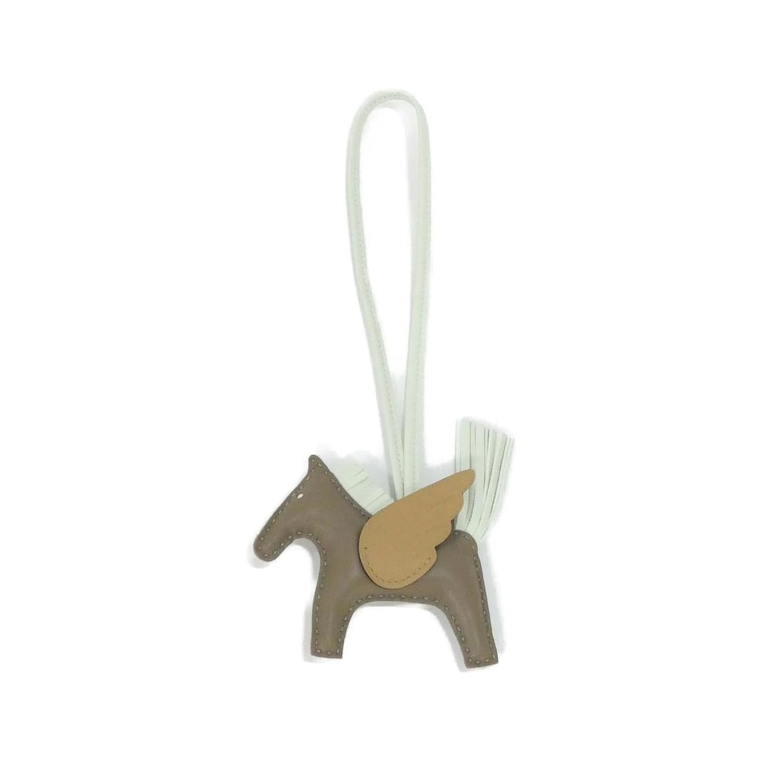 Hermes Hermès Rodeo Pegasus Handbag Charm PM 083010CA: --- Catalog ---Category: SizeSize (HxWxD): 8cm x 9cm / 3.14'' x 3.54''Category: DesignType: HandbagColor: Biscuit, Etoupe grayGender: WomenMaterial: Agneau Milo Category: GeneralMPN: 083010CABrand: He