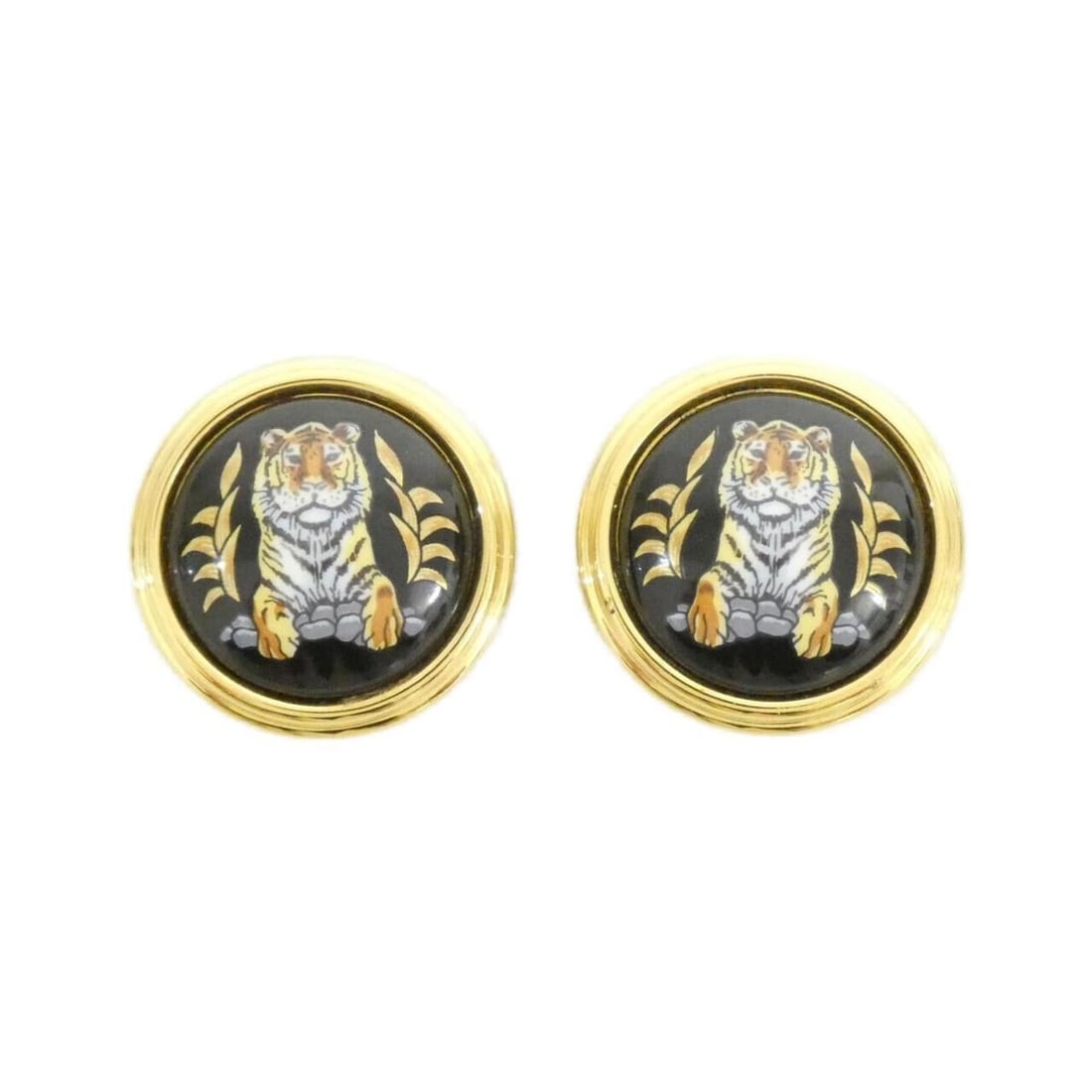 Hermes Earrings: --- Catalog ---Category: DesignType: Clip earringsColor: Black, GoldGender: WomenMaterial: PalladiumCategory: GeneralBrand: Hermes--- Item List ---Section: ConditionRanking: Rank A Used - A few traces