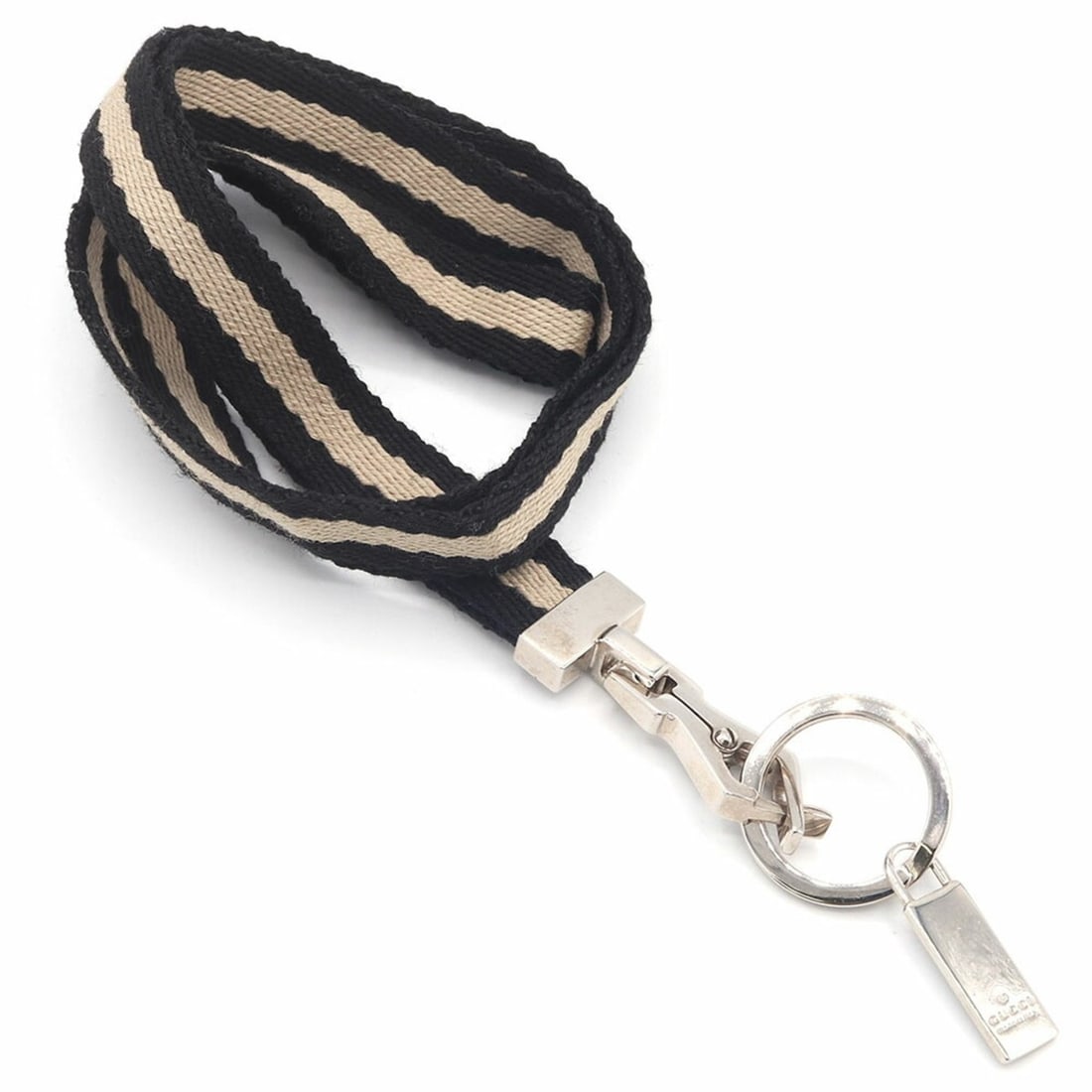 Gucci neck strap in black and beige, canvas metal with a striped design. Keyring keychain for men: --- Catalog ---Category: DesignType: Neck strapColor: Beige, BlackMaterial: Canvas, MetalCategory: GeneralBrand: GucciCountry of Origin: Italy--- Item List ---Section: ConditionRanking: Rank A Used -