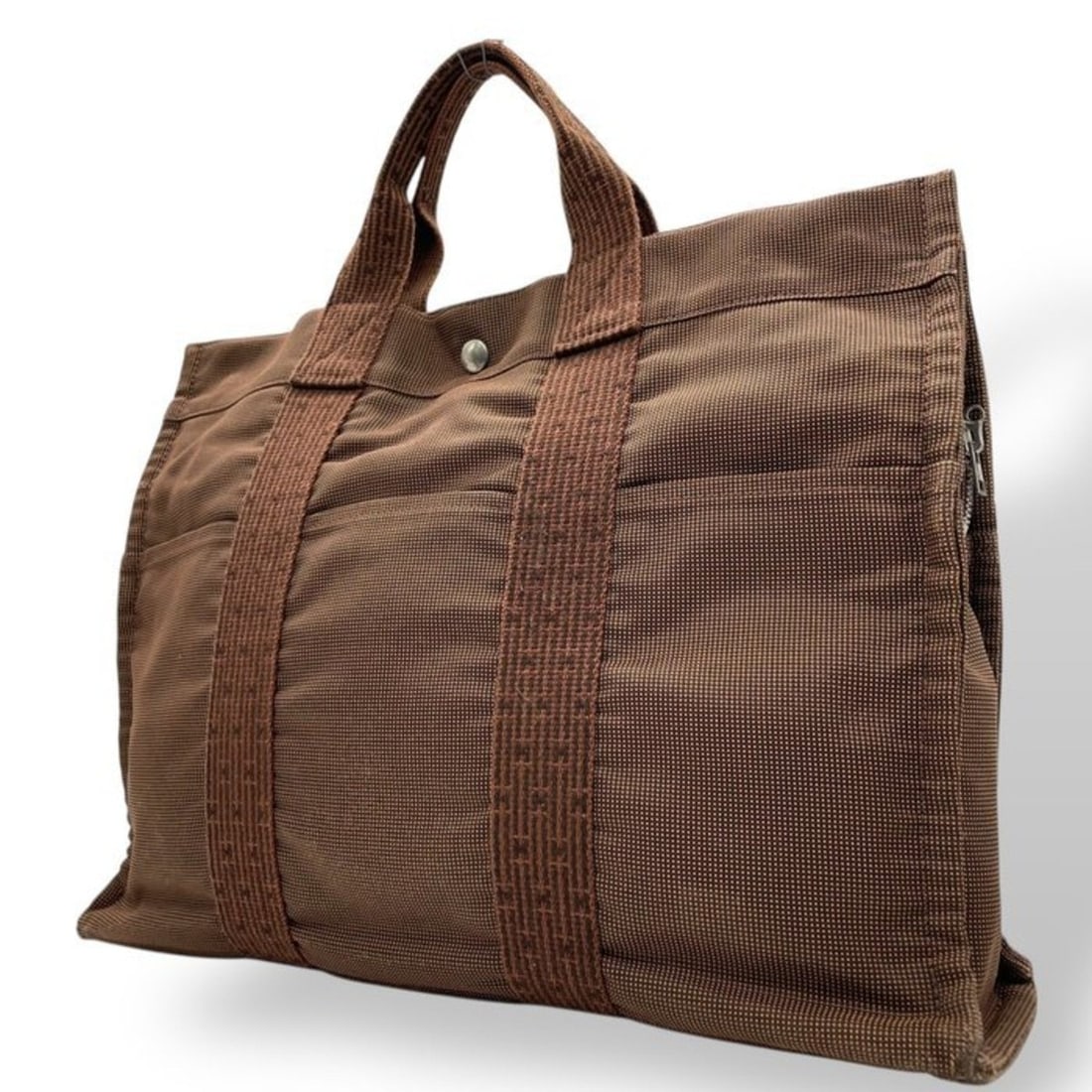 HERMES Herline MM Hermès Air Line Tote Bag Canvas Brown with Silver Hardware Handbag for Men and: --- Catalog ---Category: SizeSize (HxWxD): 32cm x 42cm x 11cm / 12.59'' x 16.53'' x 4.33''Category: DesignType: Handbag, Tote bagColor: BrownGender: Men,WomenMaterial: Canvas Category: GeneralBrand: H