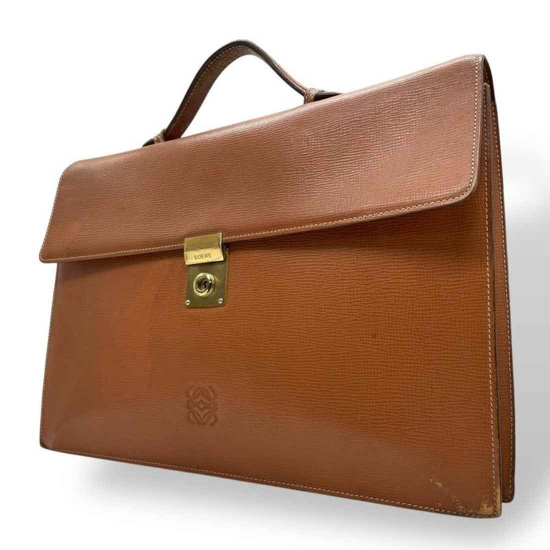 LOEWE Anagram Embossed Leather Business Bag Briefcase Brown with Gold Hardware (13k Gold): --- Catalog ---Category: SizeSize (HxWxD): 28cm x 39cm x 6cm / 11.02'' x 15.35'' x 2.36''Category: DesignType: BriefcaseColor: BrownGender: Women,MenMaterial: Leather Category: GeneralBrand: Loewe---