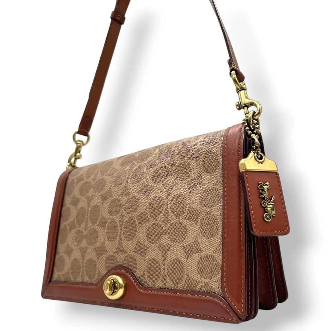 Coach Signature 31070 Turnlock Shoulder Bag/Handbag in Brown, Tan, and Camel Leather with Gold: --- Catalog ---Category: SizeSize (HxWxD): 15cm x 25cm x 8cm / 5.9'' x 9.84'' x 3.14''Category: DesignType: Handbag, Shoulder bagColor: Brown, CamelGender: WomenMaterial: PVC , Leather Category: Gener