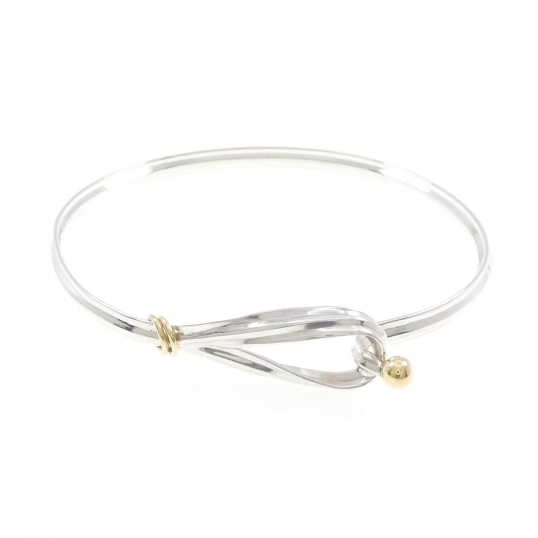 Tiffany Love Knot Bangle: --- Catalog ---Category: SizeLength: 18cm / 7.08''Category: DesignType: BangleGender: WomenMaterial: Silver 925, Yellow gold (18K)Category: GeneralBrand: Tiffany--- Item List ---Section: ConditionRank