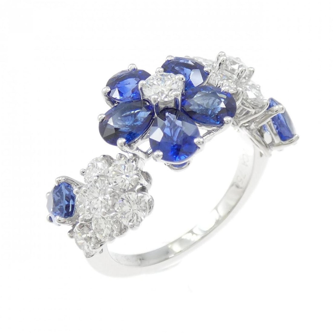 Van Cleef & Arpels Folie des Pres Ring: --- Catalog ---Category: SizeUS Size: 6.5Brand Size: 52Category: DesignType: Band ringStone: Diamond, SapphireGender: WomenMaterial: White gold (18K)Category: GeneralBrand: Van Cleef & Arpels--- Item