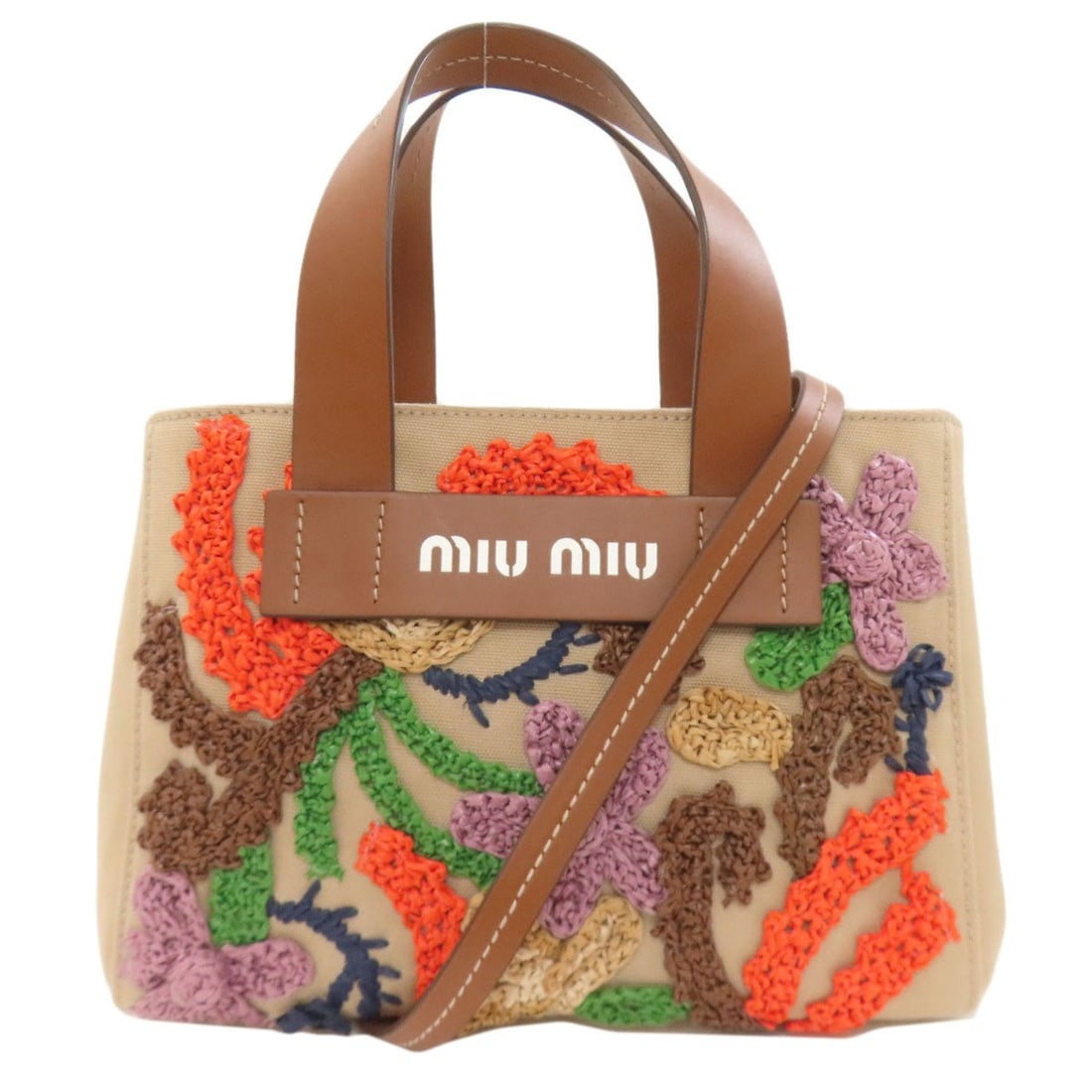 Miu Miu Miu Flower Motif 2-Way Canvas Handbag for Women MIUMIU: --- Catalog ---Category: SizeSize (HxWxD): 18cm x 26cm x 10cm / 7.08'' x 10.23'' x 3.93''Category: DesignType: HandbagColor: BrownGender: WomenMaterial: Canvas Category: GeneralBrand: Miu Miu--- Item