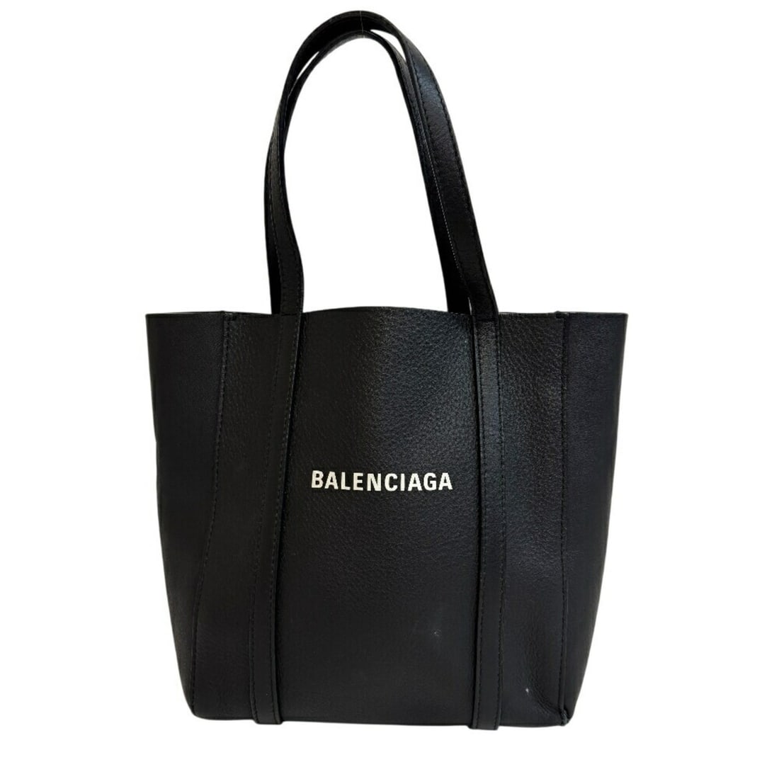 BALENCIAGA Everyday XXS Handbag in Black for Women: --- Catalog ---Category: SizeSize (HxWxD): 22.5cm x 26.5cm / 8.85'' x 10.43''Handle Length: 15cm / 5.9''Category: DesignType: HandbagColor: BlackGender: WomenMaterial: Leather Category: GeneralBrand: