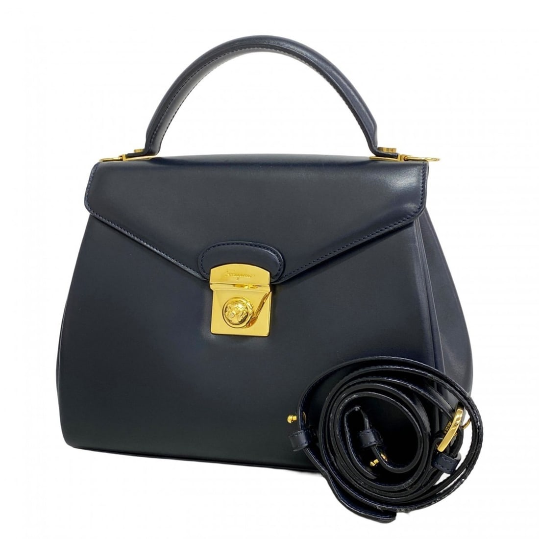 Salvatore Ferragamo navy leather handbag, 2-way bag for women: --- Catalog ---Category: SizeSize (HxWxD): 20cm x 25cm x 11cm / 7.87'' x 9.84'' x 4.33''Category: DesignType: HandbagColor: NavyGender: WomenMaterial: Leather Hardware Color: GoldCategory: GeneralBran
