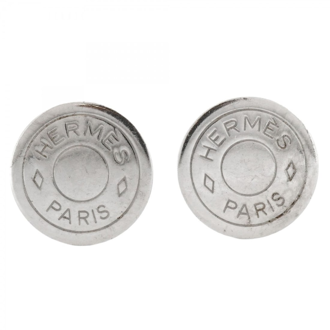 Hermes Serie Metal Silver Earrings for Women: --- Catalog ---Category: SizeSize (HxWxD): 20.00mm x 20.00mm / 0.79'' x 0.79''Category: DesignType: Clip earringsColor: SilverGender: WomenMaterial: MetalCategory: GeneralBrand: Hermes--- Item List --