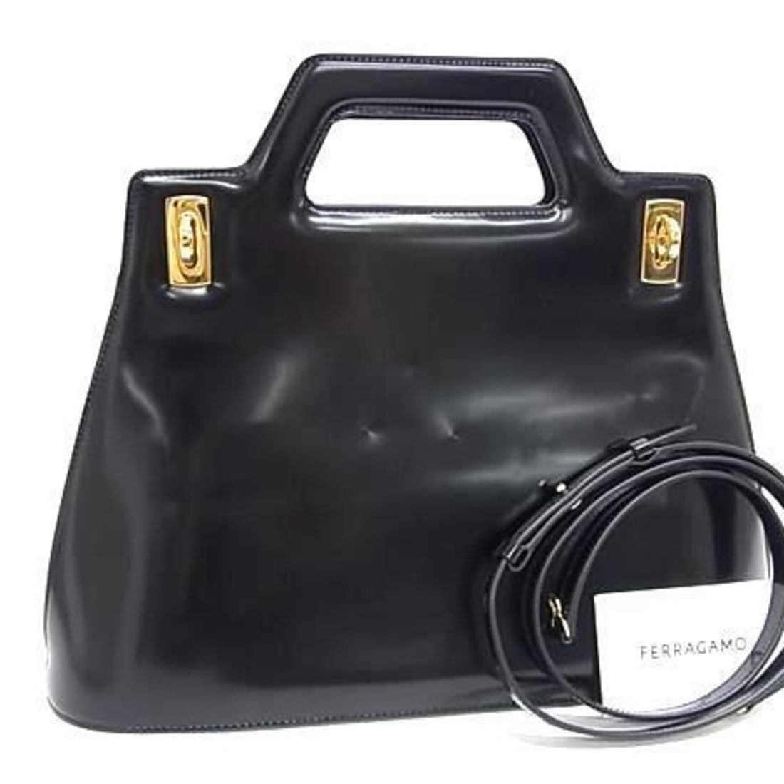 Salvatore Ferragamo Gancini Wanda 21 handbag (3961) in black patent leather for women: --- Catalog ---Category: SizeSize (HxWxD): 22.5cm x 36cm x 10cm / 8.85'' x 14.17'' x 3.93''Category: DesignType: Handbag, Shoulder bagColor: BlackGender: WomenMaterial: Patent leather Category: Genera